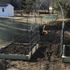 Rototilling and preparing soil for the vegetable garden in late winter. 