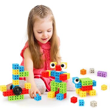 A young girl playing with colorful building blocks, creating various shapes.