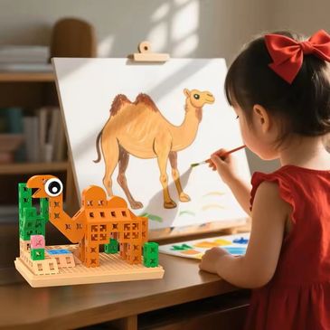 A young girl painting a camel with a toy camel model on the table.