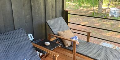 Sun loungers at the stomps and company river cabin