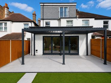Modern backyard with pergola and lawn.