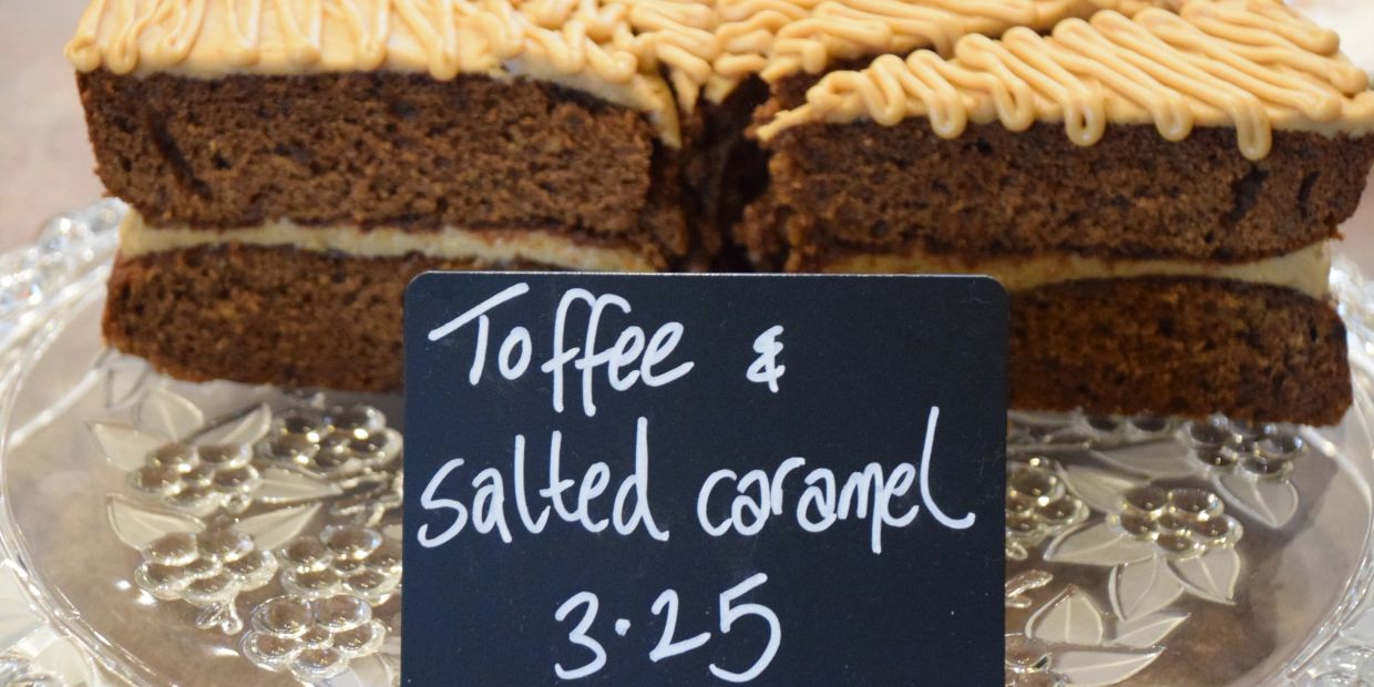 Toffee and salted caramel cake slices with a price sign.