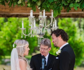 marriage ceremony at the carvers cottage overlooking woods and pond.