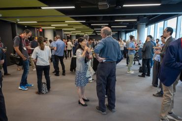 People socializing in a modern indoor space.