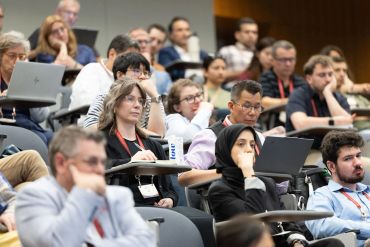 Audience attentively listens during a conference.