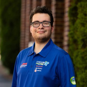 Man in blue Cyclum Technologies polo shirt.