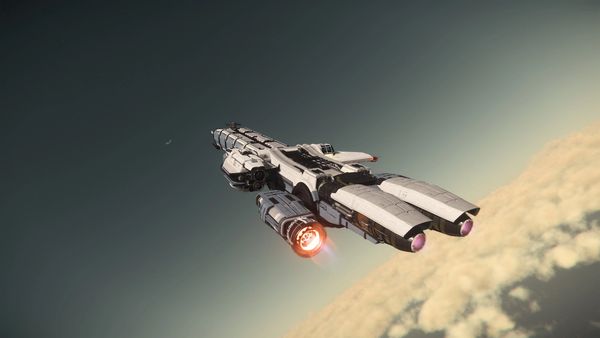 A Drake Caterpillar flies above Hurston in Star Citizen.