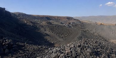 Rocky mountainous landscape under a clear sky.
