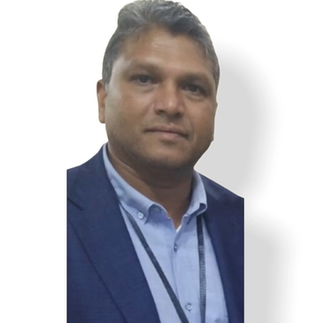 Man in a blue blazer and light blue shirt.