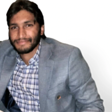 Man in gray blazer and checkered shirt.