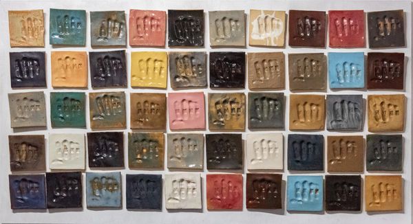 Hit tiles, variety of colors with DYKE word. Made by ceramic artist Kenza Gray (Norwich, Norfolk)