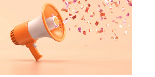 Confetti blowing out of an orange and white megaphone