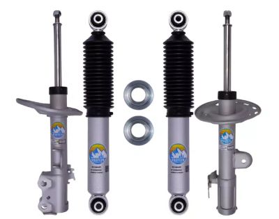 Set of four silver and black shock absorbers with two silver rings.