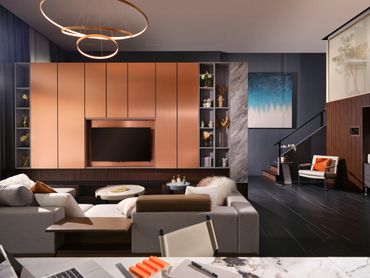 Modern living room with sleek cabinetry, cozy seating, and elegant lighting.