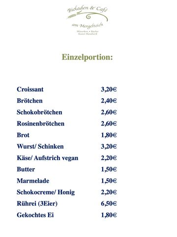 Menu listing breakfast items with prices in euros at a café.