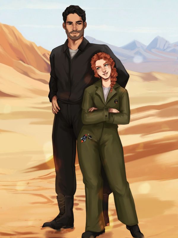 A tall dark haired man stands behind a short red haired woman