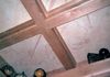 Corner detail of coffered library, showing some of the children's globe collection, on crown shelf.