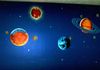 This was done for a client who's son was studying the solar system, so we painted a mural of the planets, with their moons.