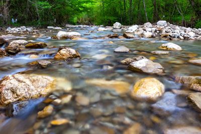 Photo of river running over rocks.  