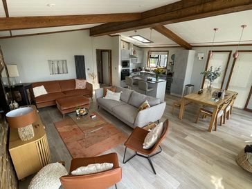 Open plan living and dining area with kitchen.