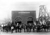 1877 - The three different companies (Excelsior, Everett, and Loveland) that made up Golden Fire Department posing in front of Central Station.