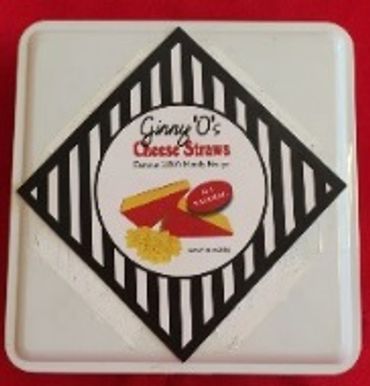 Tin of Ginny O's Cheese Straws with no sugar added.