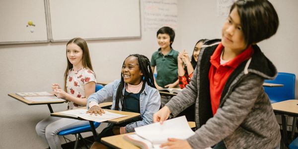 Students in class smiling