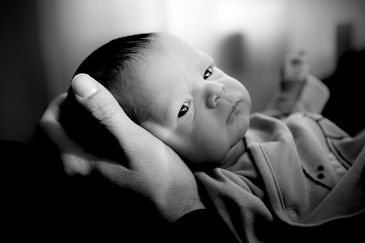 Newborn baby in fathers hands Ridgewood queens new york