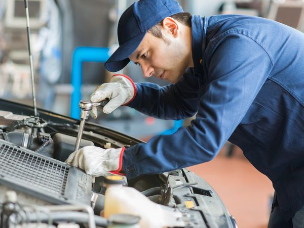 An auto mechanical engineer working on a car