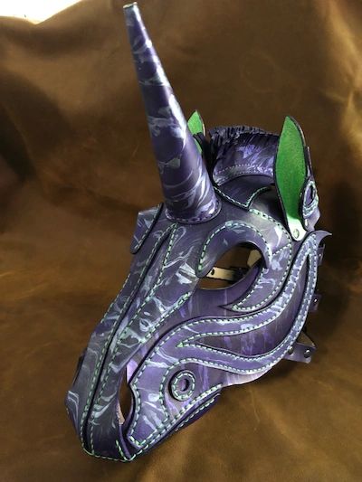 Purple unicorn created out of leatherwork.