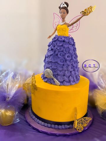 Princess-themed cake with purple rosette dress and yellow base.