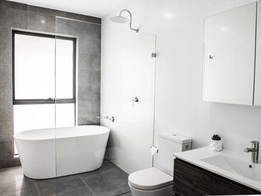 Elegant luxury bathroom with freestanding stone bathtub