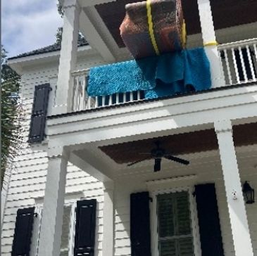 Mt Pleasant Movers accomplishing a strategic furniture placement, that was unable to go through door