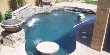 Custom Pool Design with tables and hardscape