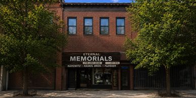 Brick building storefront for Eternal Memorials.