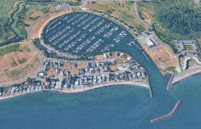Aerial view of a coastal marina filled with boats.