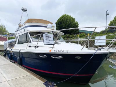Boat named "The Dream Boato" docked at marina.
