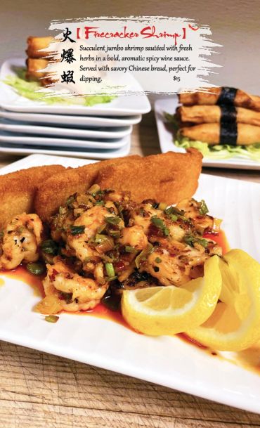 Jumbo shrimp sautéed in spicy wine sauce with Chinese bread and lemon wedges.
