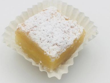 Zesty Lemon Bar Delight with a Dusting of Powdered Sugar