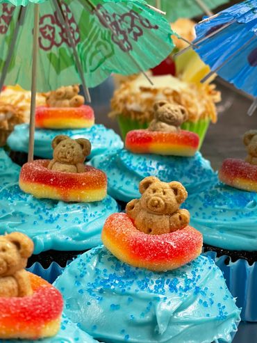Adorable Beach-Themed Cupcakes with Blue Frosting and Teddy Graham Surfers