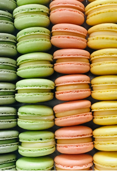 Colorful macarons in a mesmerizing rainbow color pattern, a delightful treat for the senses.