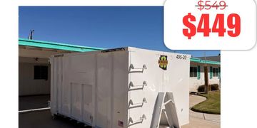 Large white dumpster outside a building with a sale price of $449.