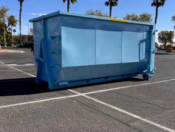 large dumpster is parking lot