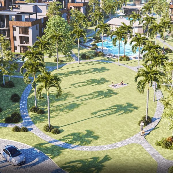 Modern residential area with palm trees, swimming pool, and people relaxing outdoors.