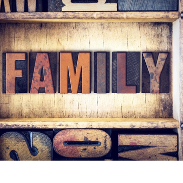Wooden blocks spelling FAMILY.