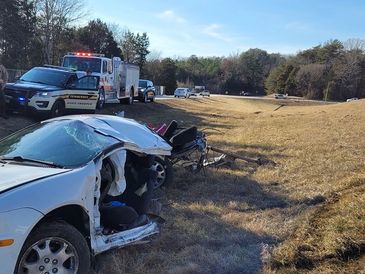  A car torn up in an accident is visible
