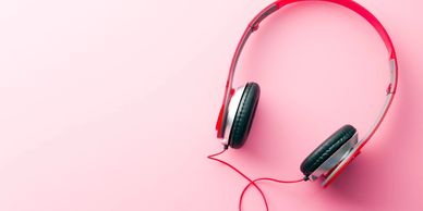 Pink headphones on a pink background