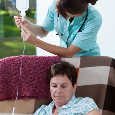 Registered Nurse administering Intravenous Infusion