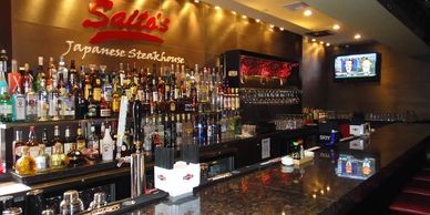 Picture of Saito's drinks bar. Clicking on the picture will take you to the Saito's Drinks menu.