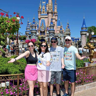 Disney family in front of Cinderella Castle